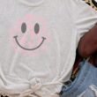 jit-3413-cement-xs-cowspotssmileycow-spots-happy-face-tri-blend-short-sleeve-tee-520651.jpg Cow Spots Happy Face Tri-Blend Short Sleeve Tee
